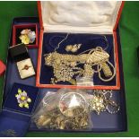 A box of costume jewellery to include white metal charm bracelets, silver charm bracelet,