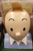 A collection of Tintin items including twenty vintage and modern books,