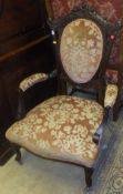 A pair of Victorian mahogany framed salon chairs with serpentine front seat and peach ground