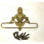 A gilded towel rail in the form of a maiden,