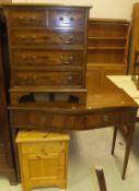 A small yew wood chest of two short over three long drawers on bracket feet,