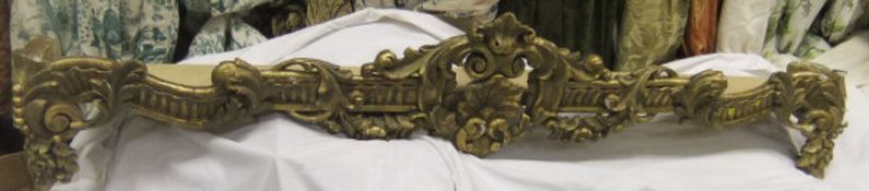 A 19th Century gilt and gesso cornice with shell decoration to the centre,