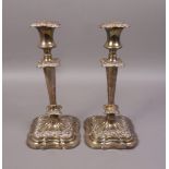 A PAIR OF EDWARD VII PLATED CANDLESTICKS