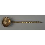 A 19TH CENTURY BRASS LADLE, the scallop