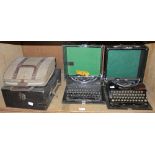 Three vintage typewriters including two