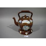 A 19th century Bargeware teapot and stan