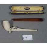 A clay pipe modelled with a fox and grap