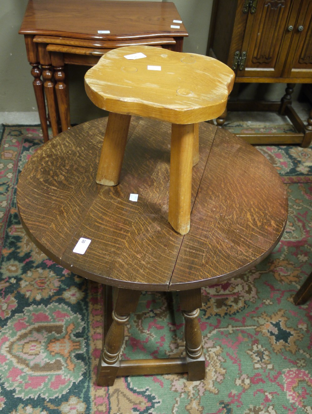 An oak oval drop leaf occasional table a