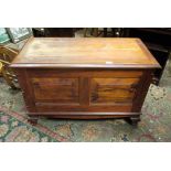 A fruitwood ottoman with twin field pane