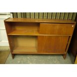 A 1970s teak open cabinet having an open