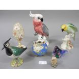 Various bird figures in pottery and glas