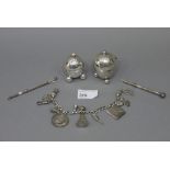 A pair of silver cruets of egg shape eac