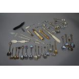 A selection of souvenir teaspoons, a bon