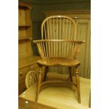 A modern elm Windsor armchair with rail