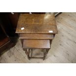 A 1920s/30s nest of three oak tables