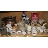 A shelf of assorted ceramics including a