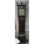 An oak longcase clock, signed T.Travis t