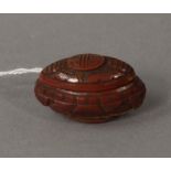 A coquille nut box and cover, carved wit