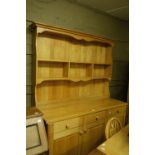 A pine dresser and rack, having a full b