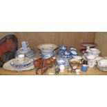 A shelf of assorted tea ware, including