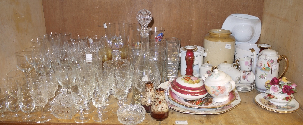 A shelf of assorted table glass, includi