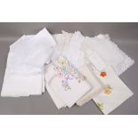 A quantity of damask embroidered drawn thread and crocheted table cloths, place mats,