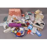 A quantity of haberdashery to include threads, ribbons, trims, satin tea cosy,