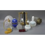 An opaline glass scent bottle and stopper, another with floral decoration, an atomiser,