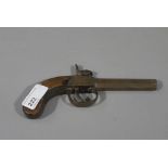 A small early 19th century percussion cap pistol with walnut stock