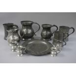 Four 18th century baluster pewter measures, another of waisted form, two cylindrical measures,