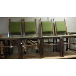 Five early 20th century oak side chairs in Arts and Crafts style with green velvet upholstered