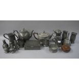 A quantity of pewter measures, teapot and cover, a Britannia metal teapot and cover,