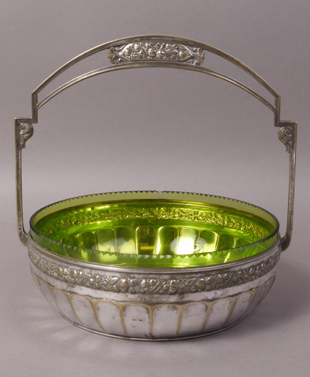 A WMF ELECTROPLATED BASKET with stiff overhead handle cast with foliate border and panelled base,