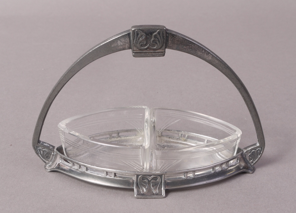 A WMF SILVER PLATED AND CLEAR GLASS CONDIMENT OR PRESERVE BASKET with arched handle,