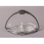 A WMF SILVER PLATED AND CLEAR GLASS CONDIMENT OR PRESERVE BASKET with arched handle,