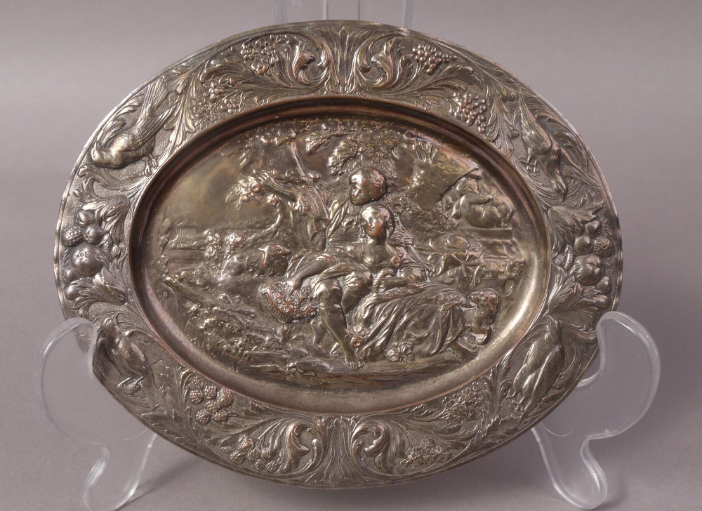 A WMF SMALL ELECTROPLATED RELIEF PLAQUE decorated with lovers in a garden setting,