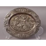 A WMF SMALL ELECTROPLATED RELIEF PLAQUE decorated with lovers in a garden setting,