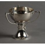 AN ART NOUVEAU SILVER THREE HANDLED GOBLET, the applied handles with stylised leaf terminals,