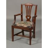 A GEORGE III STYLE MAHOGANY ELBOW CHAIR with wheat sheaf carved and scroll pierced splat,