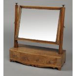 A LATE GEORGE III MAHOGANY BOWFRONT TOILET MIRROR,