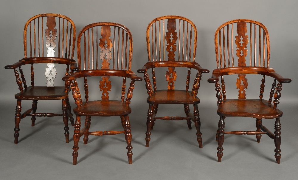 A SET OF FOUR 19TH CENTURY YEW WOOD AND ELM HIGH BACK WINDSOR CHAIRS,