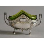A WMF SILVER PLATED AND GREEN GLASS TWO HANDLED SALT of boat shape with arched outline and