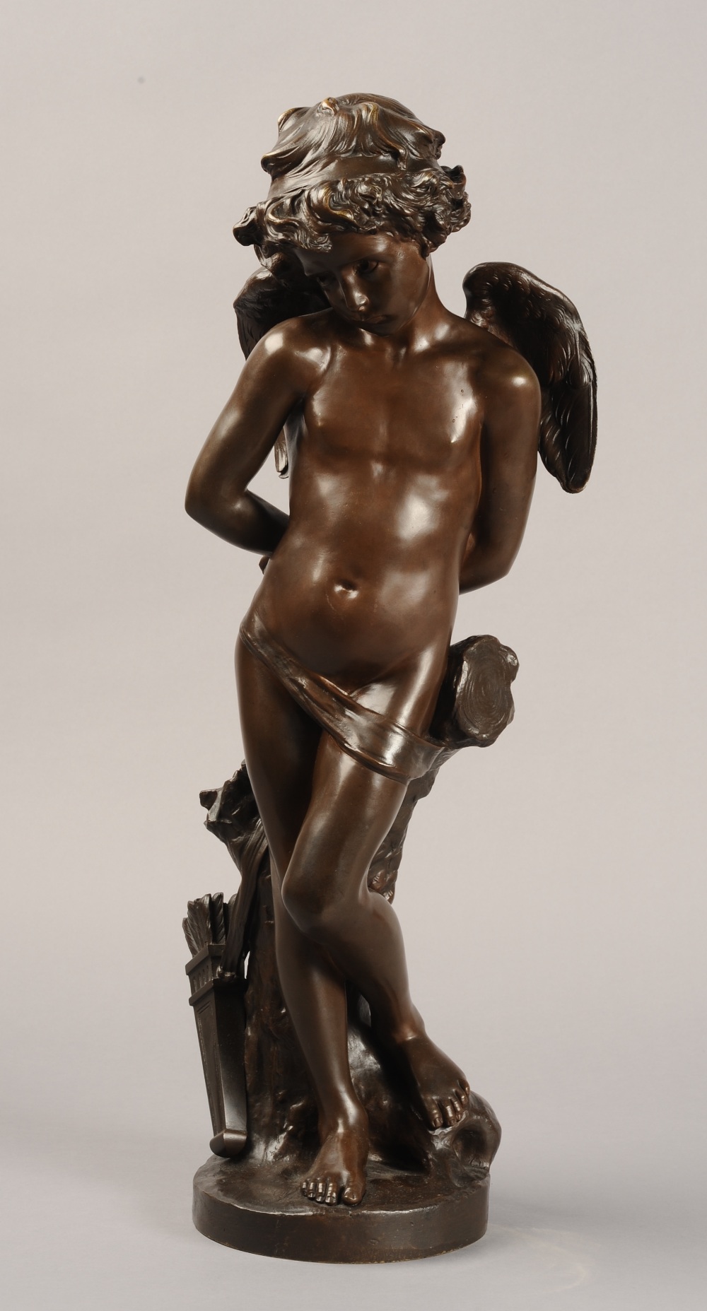 DENISE DELAVIGNE (French, fl late 19th century), a bronze figure of Cupid bound,