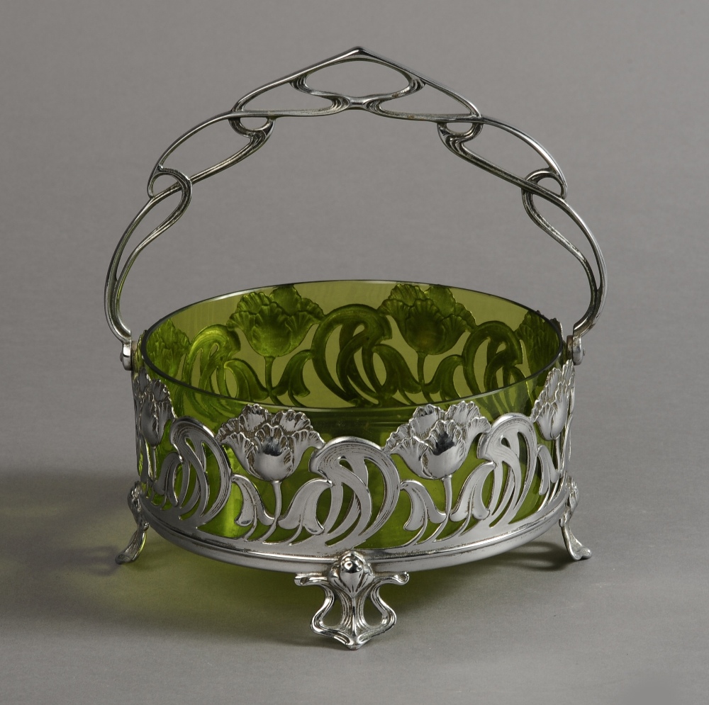 A WMF SILVER PLATED AND GREEN GLASS FRUIT BASKET of circular outline,