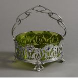 A WMF SILVER PLATED AND GREEN GLASS FRUIT BASKET of circular outline,