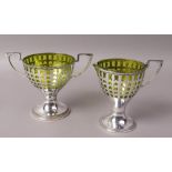 A WMF SILVER PLATED AND GREEN GLASS LINED TWO HANDLED PEDESTAL SUGAR BOWL AND CREAM JUG of pierced