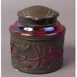 AN ART NOUVEAU BRONZE MOUNTED CRANBERRY GLASS INKWELL, circular,