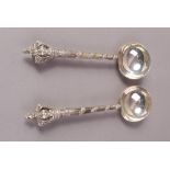 A PAIR OF DUTCH SILVER ANNOINTING SPOONS, 1913, each with lion rampant and crown finial,