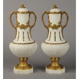 A PAIR OF LATE 19TH CENTURY FRENCH WHITE BISCUIT AND GILT BRONZE VASES,