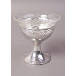 A SILVER PEDESTAL DISH with pierced border to rim and with glass liner, 8.